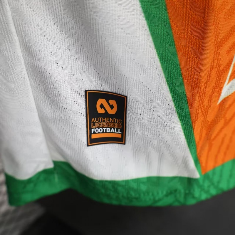 Player Version 2025 Ivory Coast Orange with Elephant Graphic and Green Accents Jersey